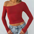 Women's slim fit viscose blend knitted cardigan with long sleeves and cross shoulder straps in solid colour.