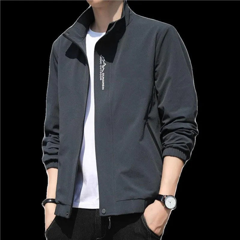 Men's black stand collar casual sports coat made from polyester fabric on a hanger.