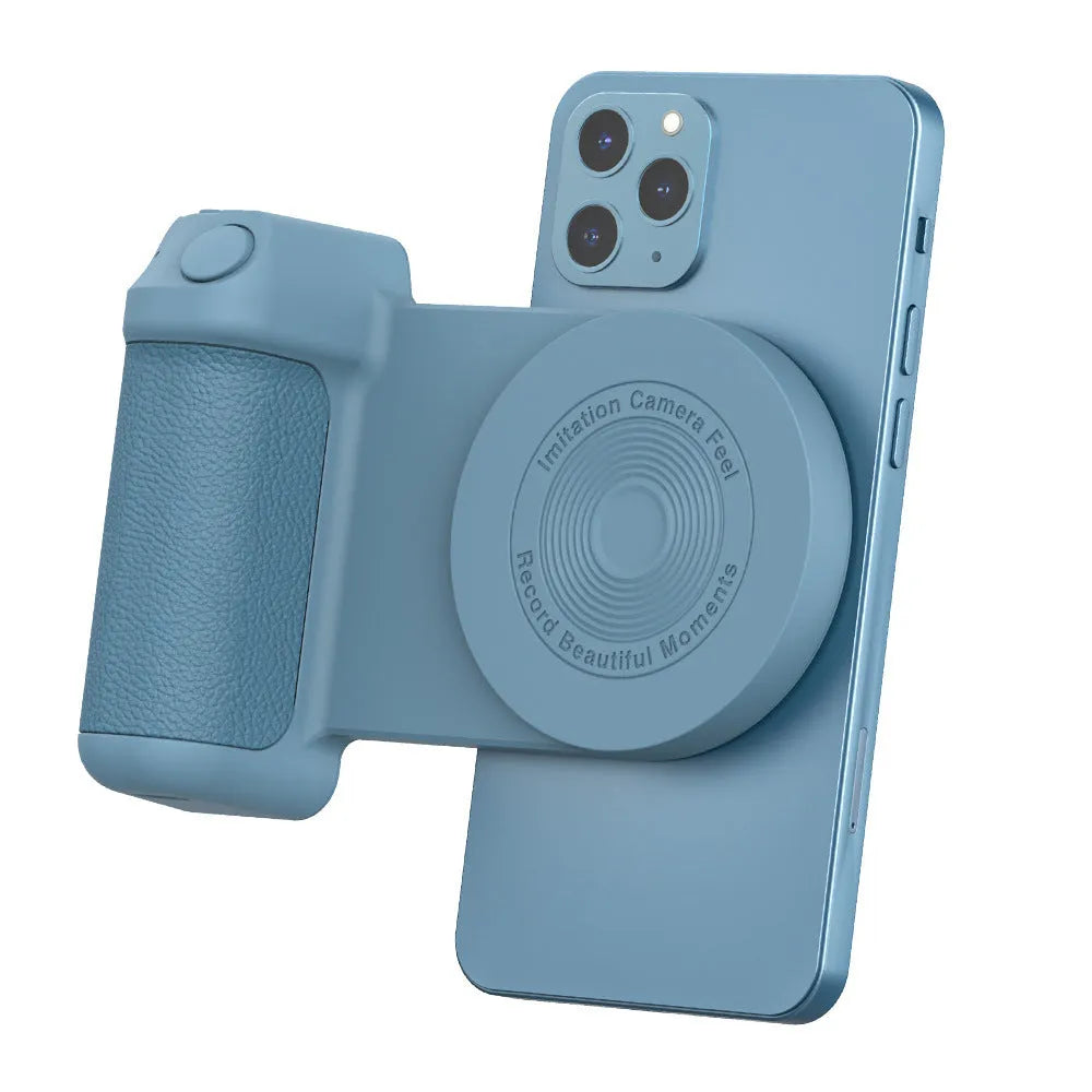 Black magnetic camera handle phone bracket with rotatable grip on wooden table