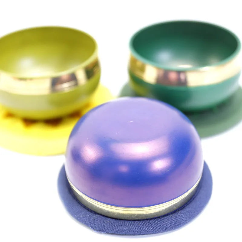 Handmade colourful Himalayan singing bowl percussion instrument measuring 7.8 cm for meditation and yoga.