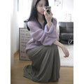 Purple women's round neck blouse with hollow-out detail and princess sleeves on a hanger.