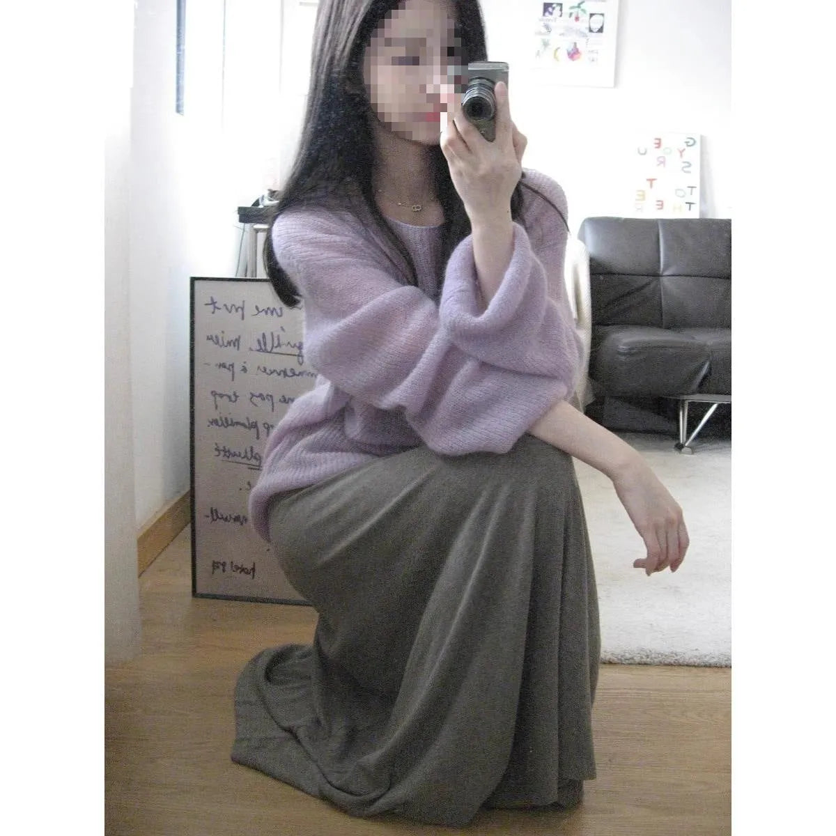 Purple women's round neck blouse with hollow-out detail and princess sleeves on a hanger.