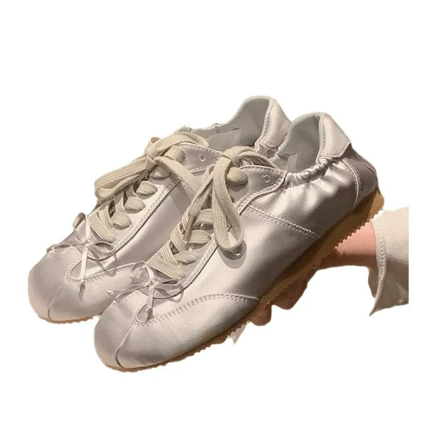 Women's ballet-style satin sports board shoes with round toe and front lace-up fastening in three colour options