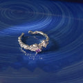 Lava purple zinc alloy open mouth ring with geometric shape and dot detailing on a white background