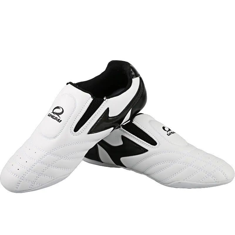 Black and white children's martial arts training shoes with a soft bottom and widened fit for Sanda and Taekwondo.