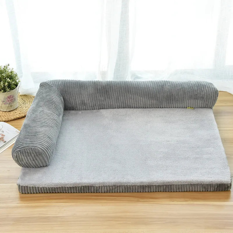 Corduroy pet sofa dog bed in grey with raised sides on a wooden floor