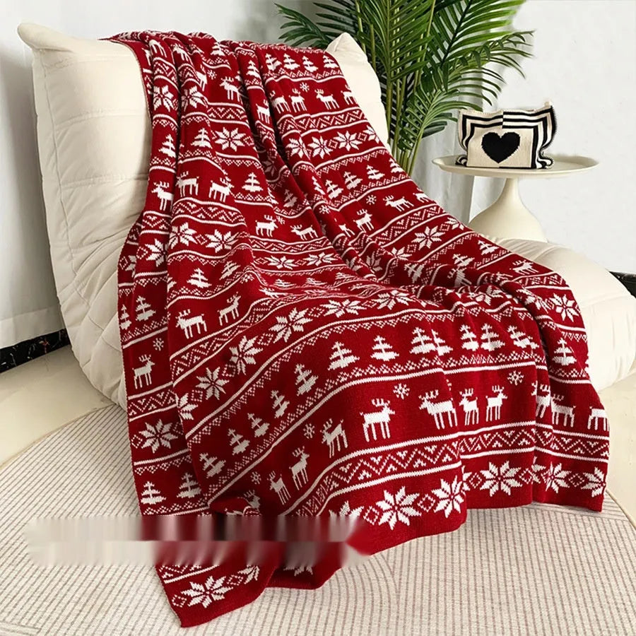 Personalised Christmas acrylic blanket with snowflake design draped over a sofa
