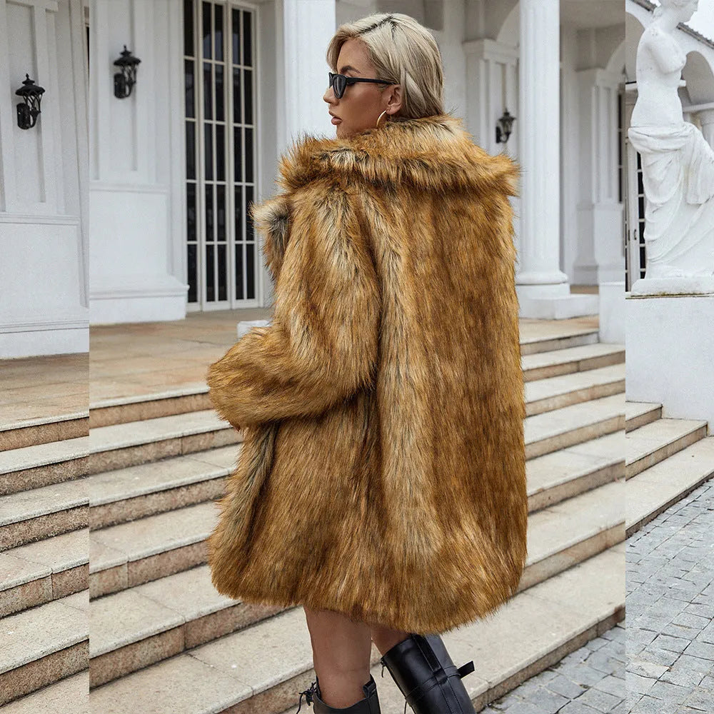 Yellow women's loose fit artificial fur coat with regular sleeves on hanger