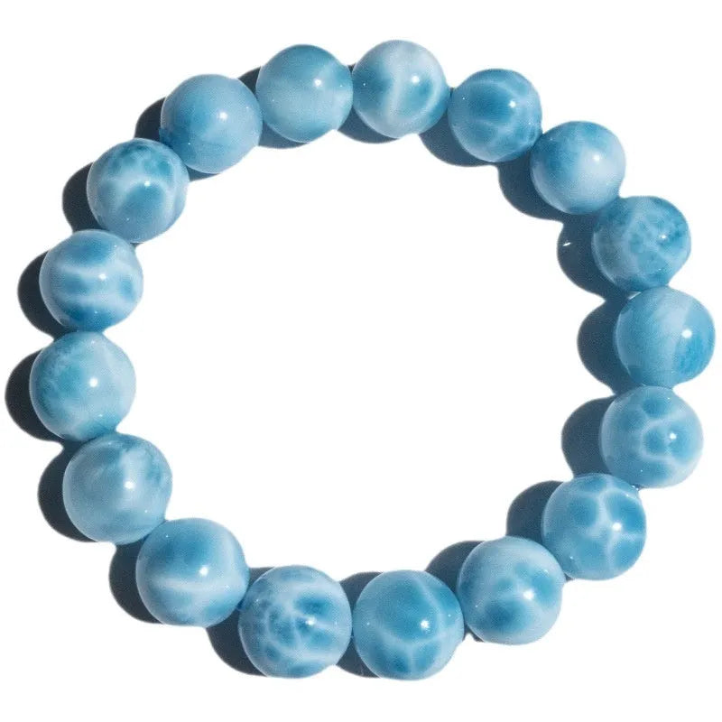 Blue bodhi bracelet with natural sea-pattern crystal stones and pearl accents in Maillard style