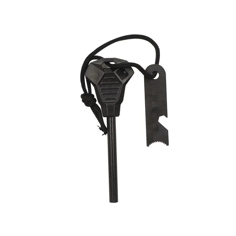 Black multifunctional camping flint with magnesium rod and stainless steel scraper showing graduated scale and bottle opener