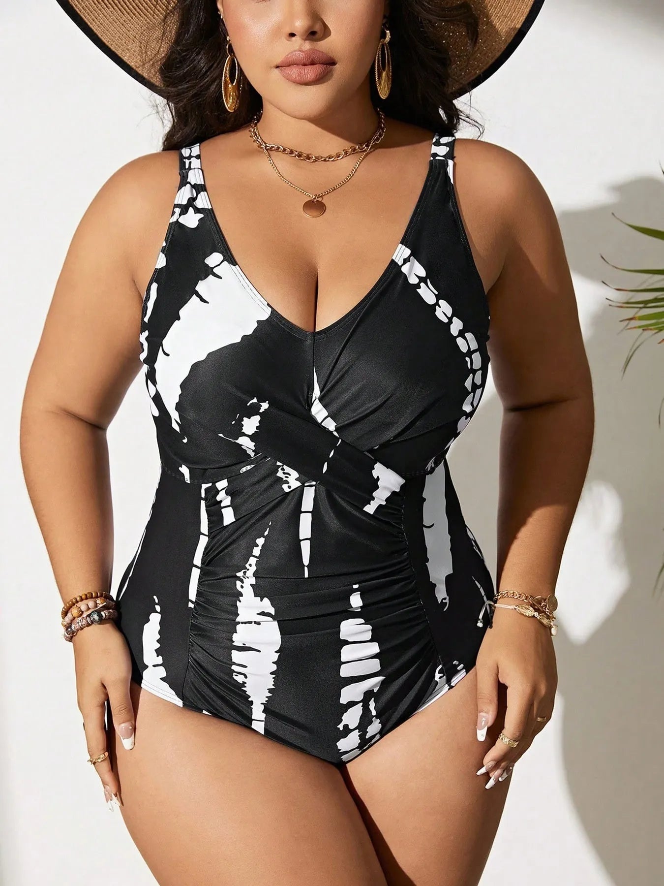 Black Siamese colour matching fit one-piece swimsuit on a hanger.