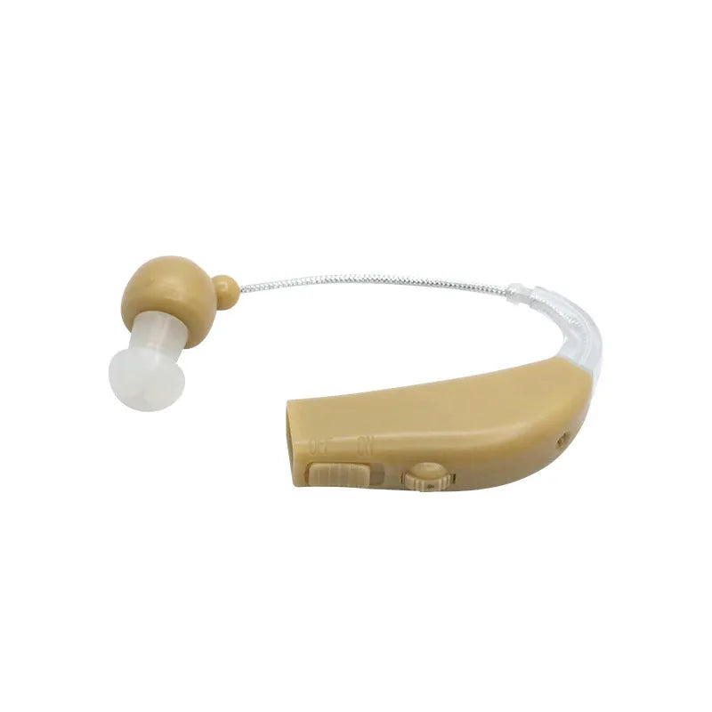 Black silicone rechargeable hearing aid amplifier for elderly users on a charging cable.