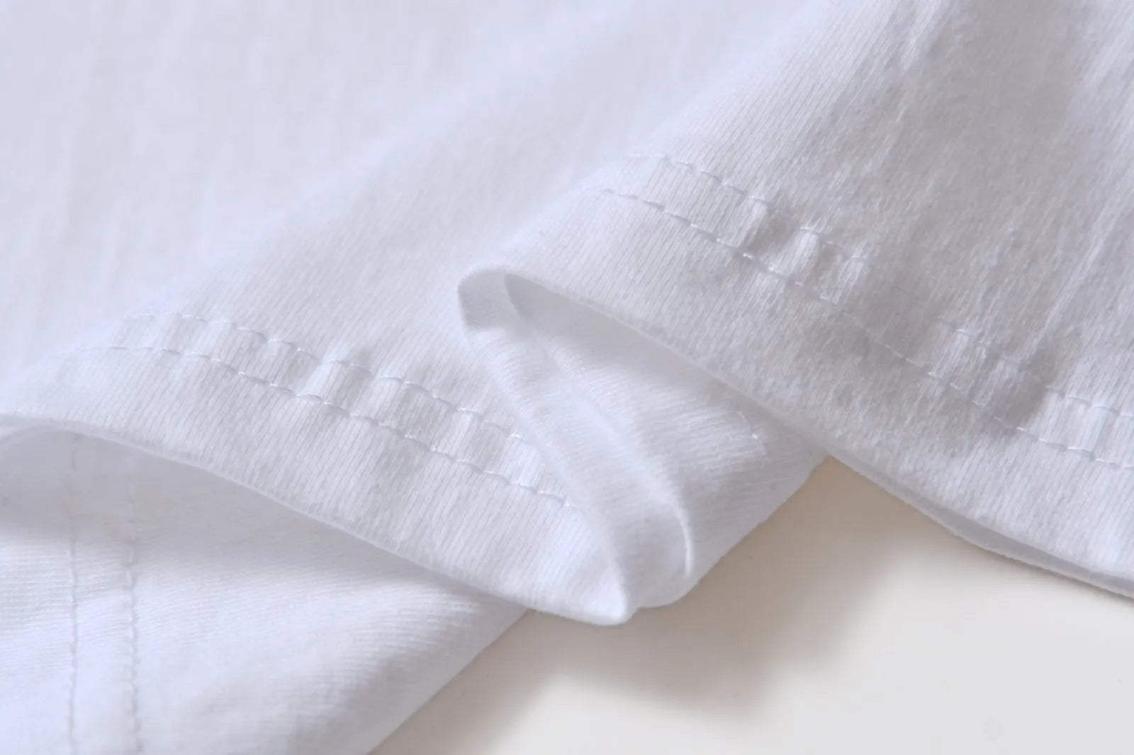 White cotton overalls with round neck and short sleeves in loose pullover style