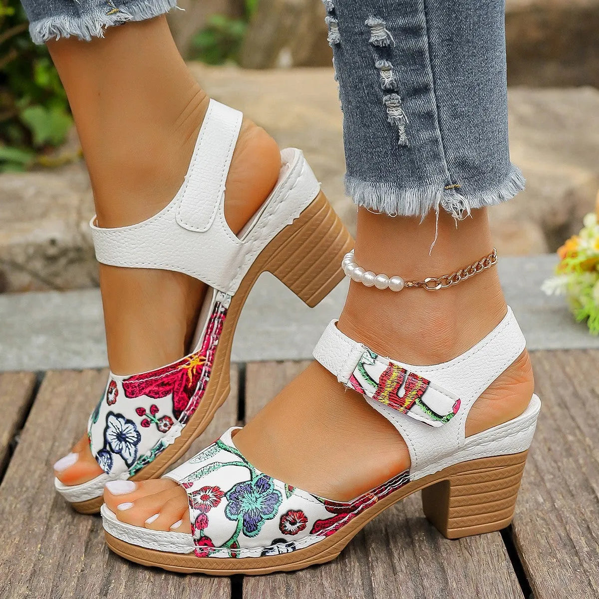 White women's high heel sandals with velcro buckle closure showing PU leather upper and rubber sole