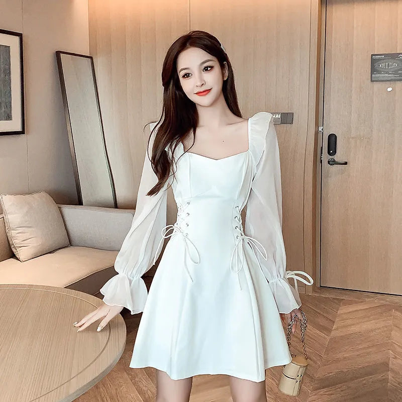 White women's long sleeve chiffon patchwork dress with a waist-slimming fit and long skirt.