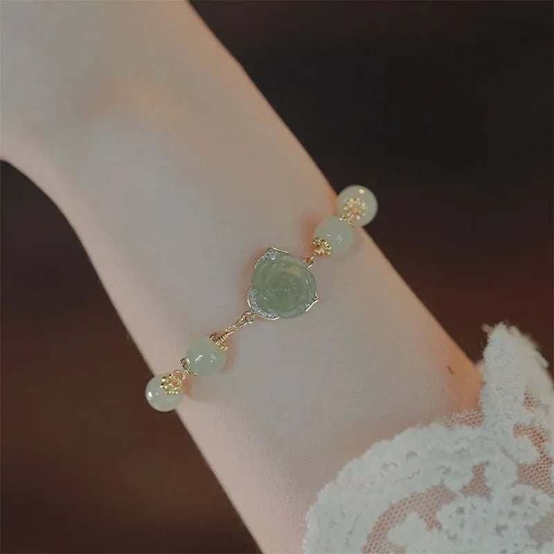 Women's bracelet with Hetian Jade Rose stone floral design and 14K gold gilding accents