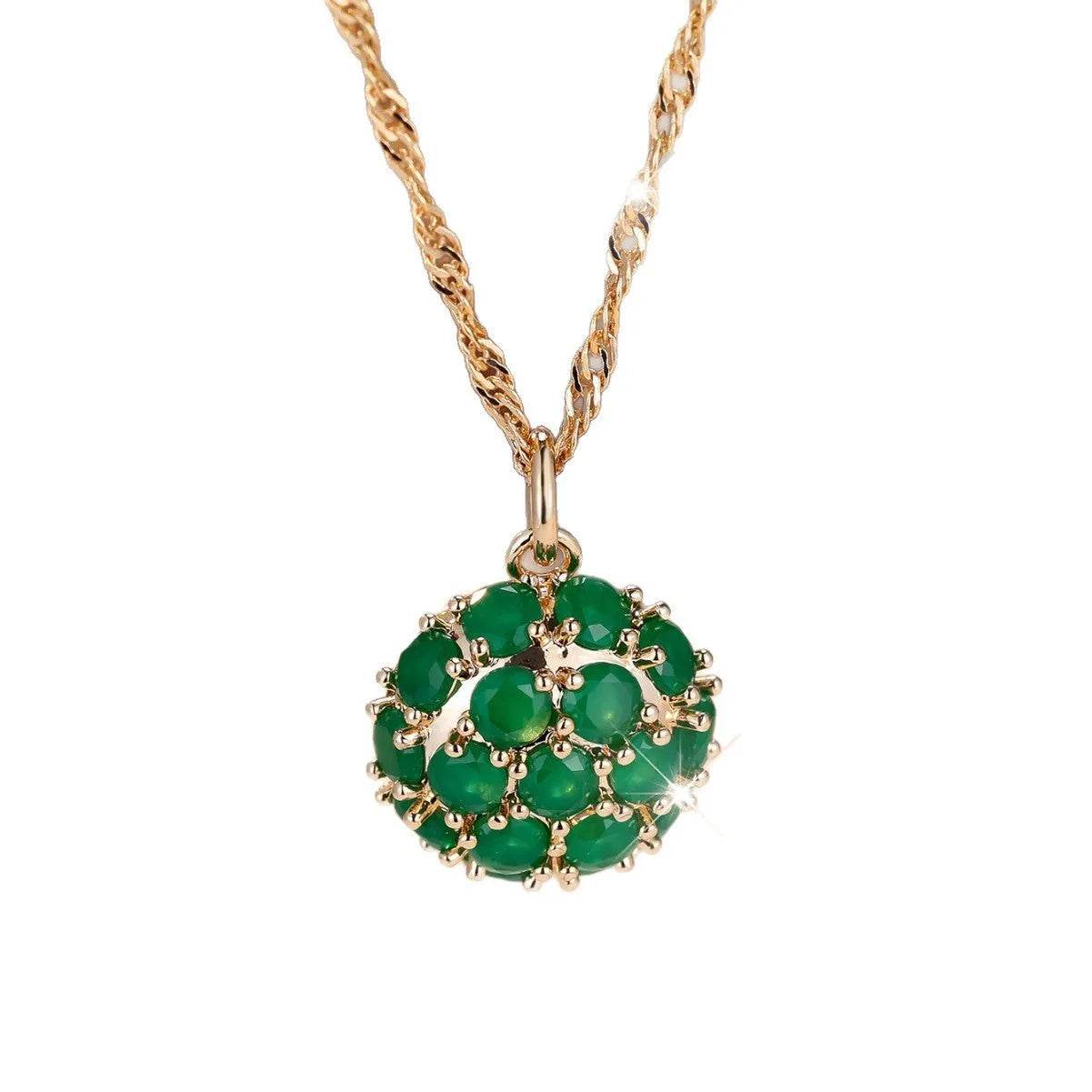 Round emerald pendant necklace with diamond surround on champagne gold chain