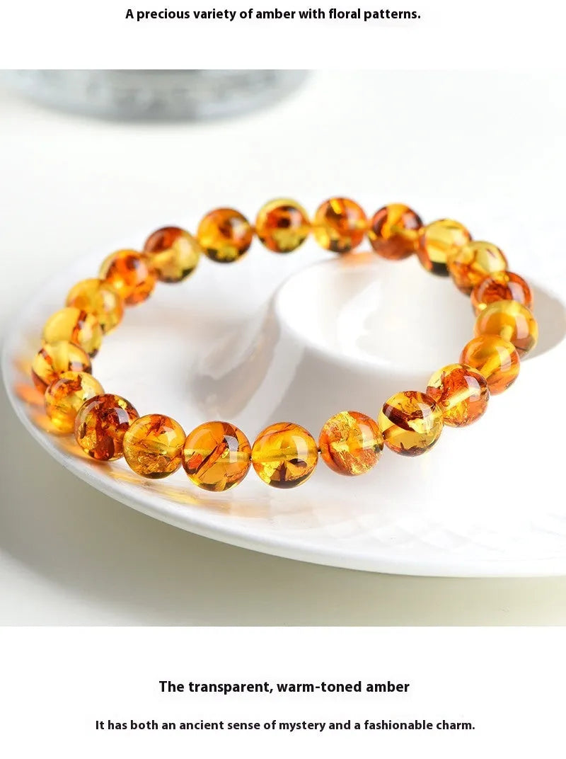 Natural yellow piebald amber bracelet with flower spot patterns and polished geometry beads