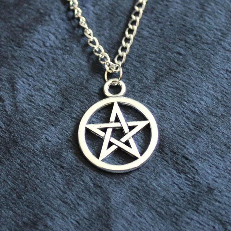Vintage pentagram necklace with alloy pendant and adjustable chain in bronze colour on neutral background