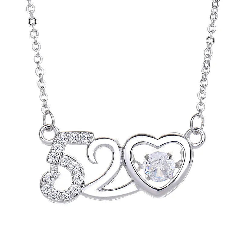 Silver or rose gold plated heart pendant necklace for women with crown and bow detailing on a chain.