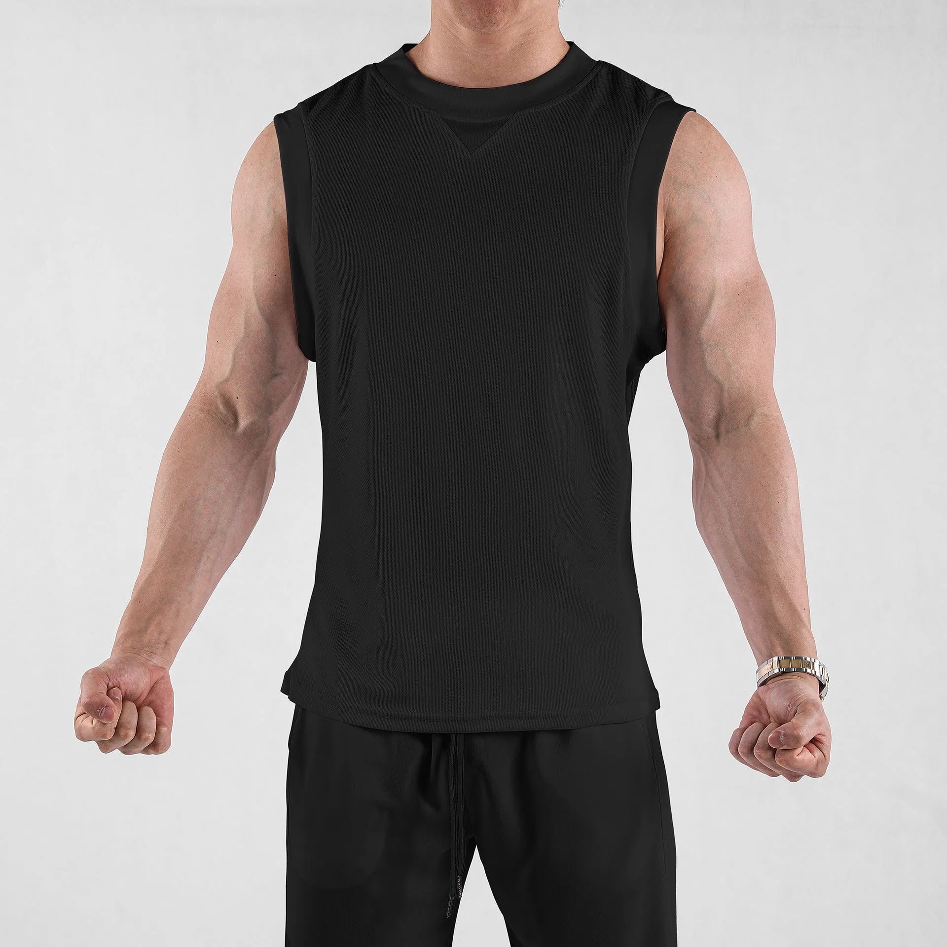 Men's loose black fitness vest made from quick-dry polyester blend fabric for summer sports.