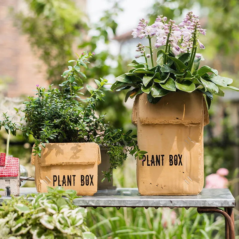 Cement brown paper box style flowerpot with bottom drainage holes for indoor planting