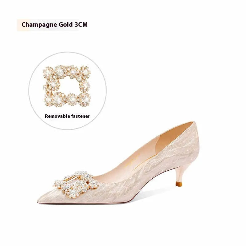 Champagne gold women's high heel pumps with pointed toe, stiletto heel, and rhinestone decoration.