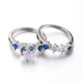 Silver-tone alloy heart-shaped geometric ring set on hand showing silver finish and multiple rings