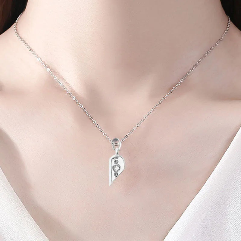 Love couple necklace pair with rotating magnet stone heart pendant in alloy and electroplating finish