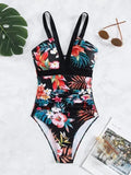 Women's black floral one-piece swimsuit with a backless design.