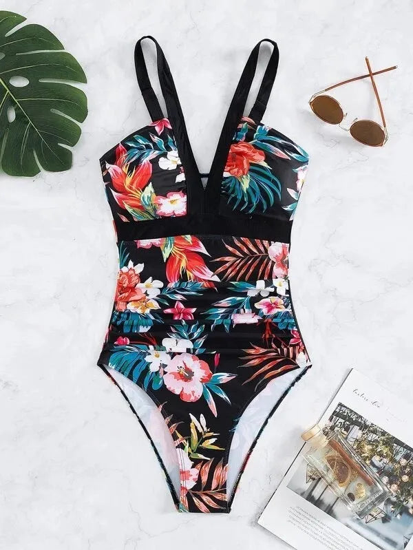 Women's black floral one-piece swimsuit with a backless design.
