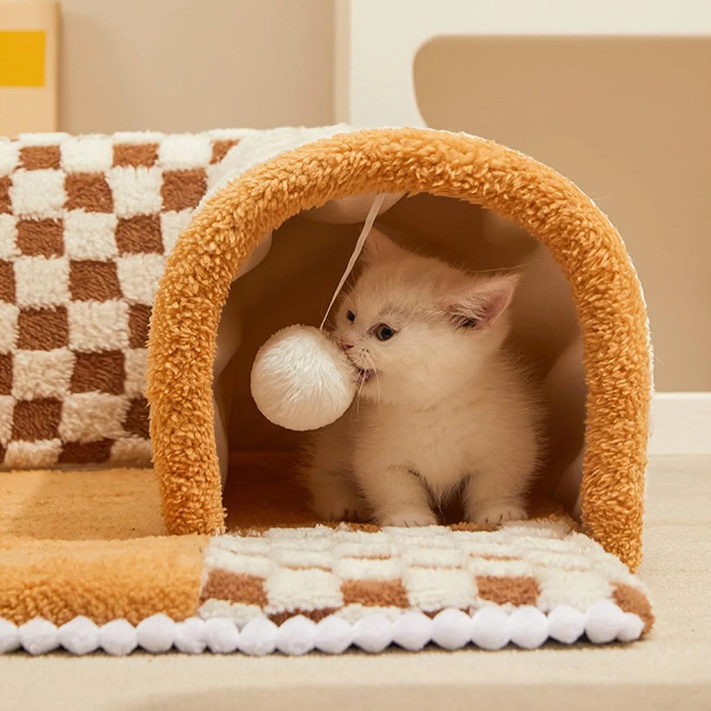 Coffee coloured plush dog and cat bed with integrated tunnel, shown in a fan-shaped plaid design