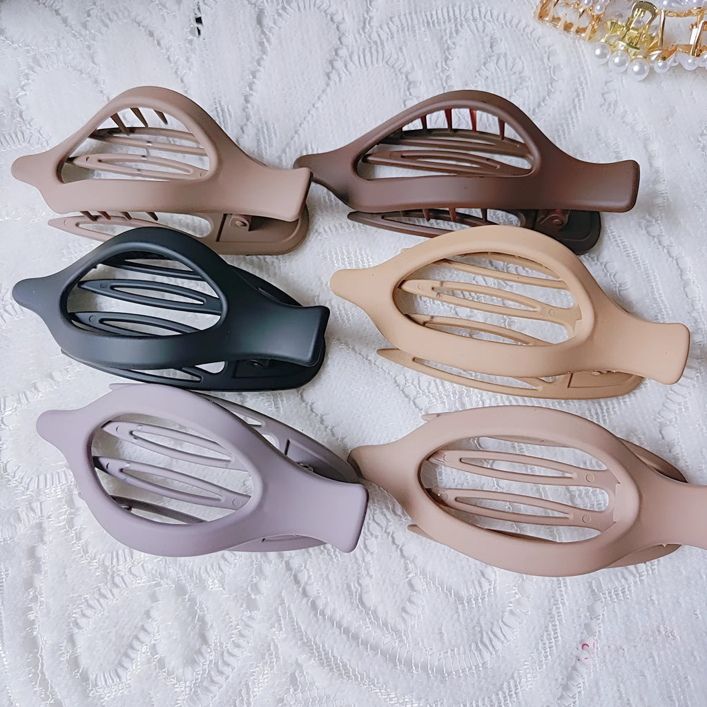 Six rose red hexagonal plastic hair clips with frosted grip, each in a separate clear OPP bag.