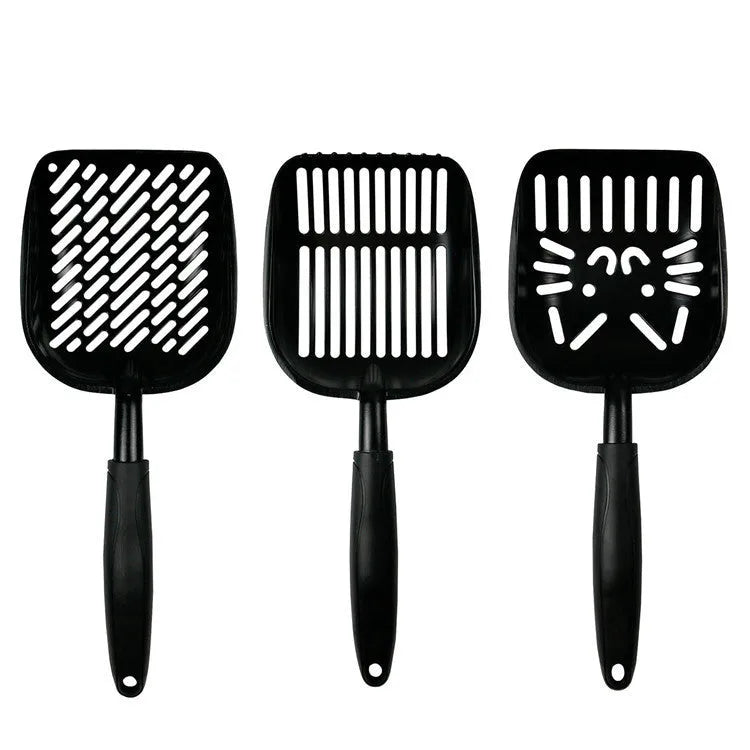 Alloy cat litter scoop with plastic handle on a cat litter box, showing cat face hole design for sifting.