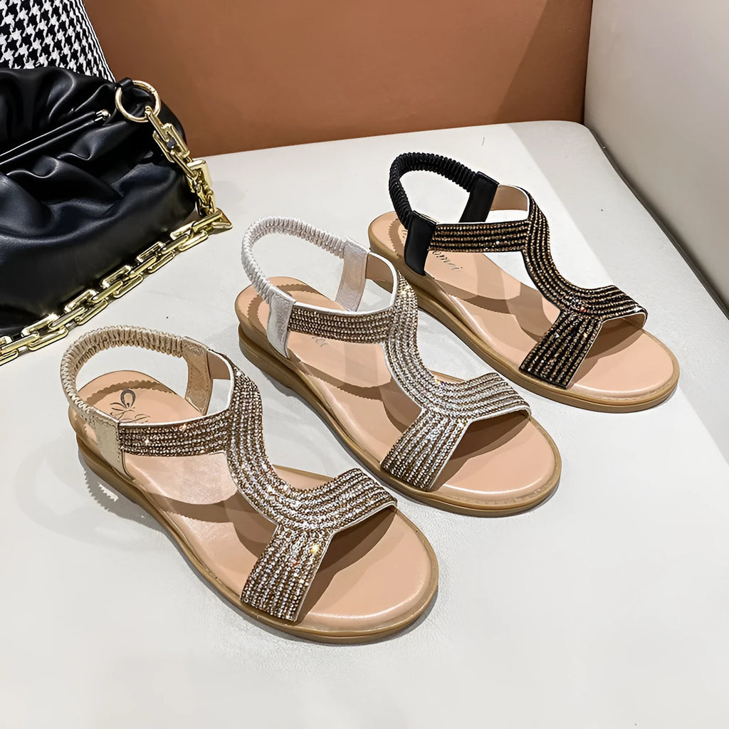 Women's patent leather beach sandals with rhinestone accents in black, gold, and silver colours