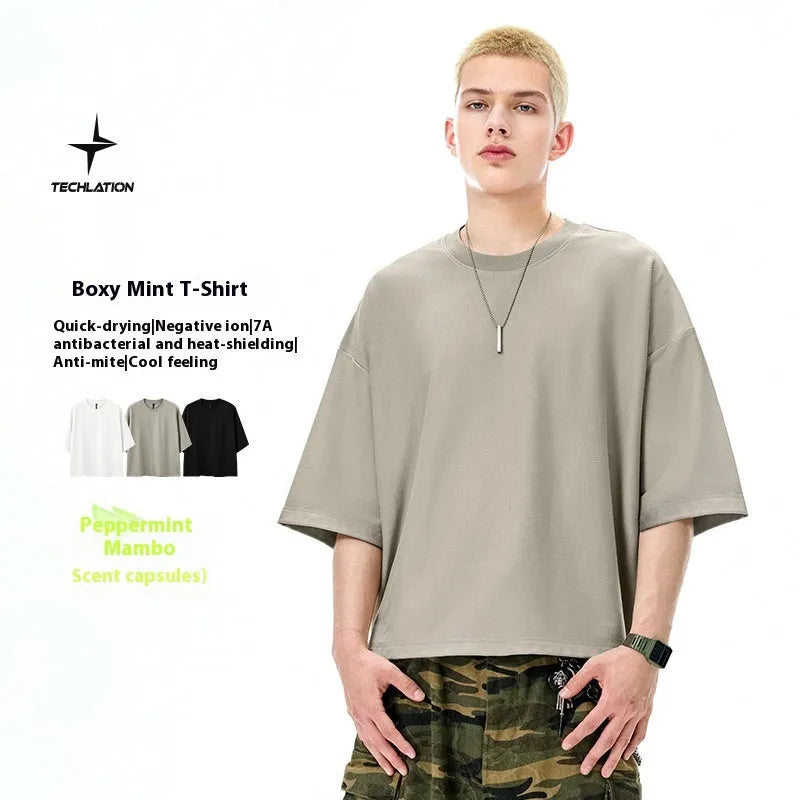 Men's loose fitting short sleeve pullover shirt in sand grey or black cotton-polyester blend fabric
