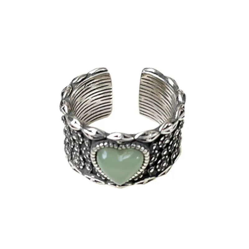 Adjustable opening love heart ring in white or green colour with retro wide-faced design