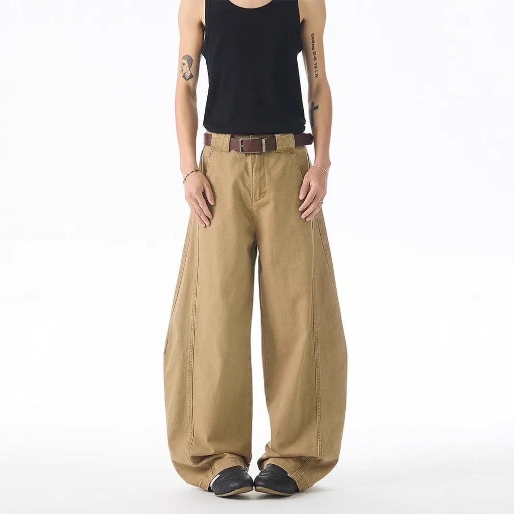 Men's brown straight-leg casual denim jeans with a loose fit and cardigan-style button fly.