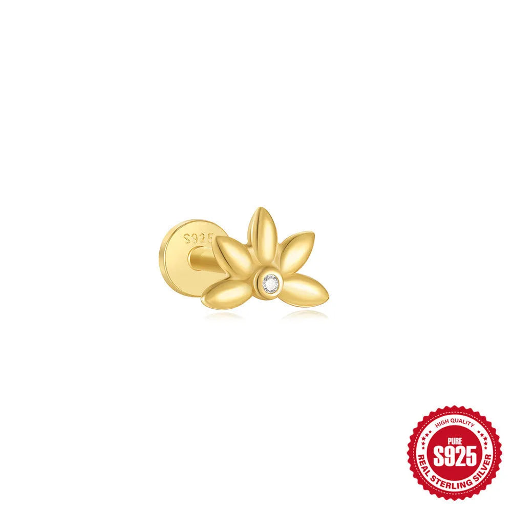 A gold tone sterling silver ear stud featuring a dangling tassel and XINGX inlaid design on the stud.