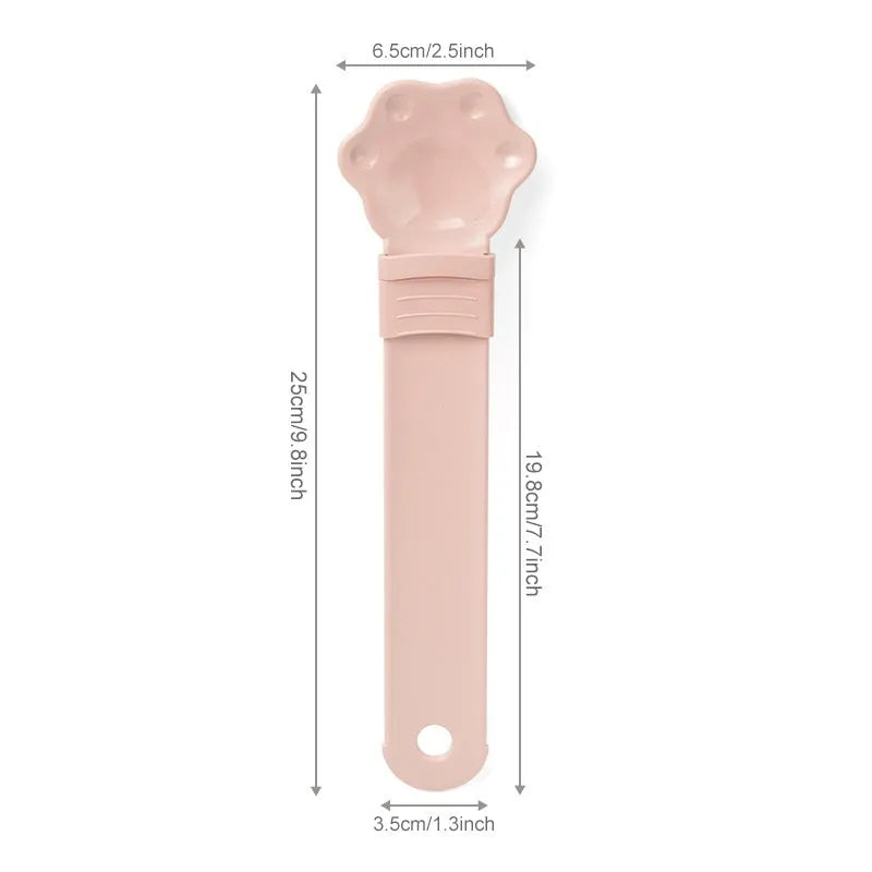 Cat food feeder squeeze tool with blue cat claw shaped spoon and sliding squeezer