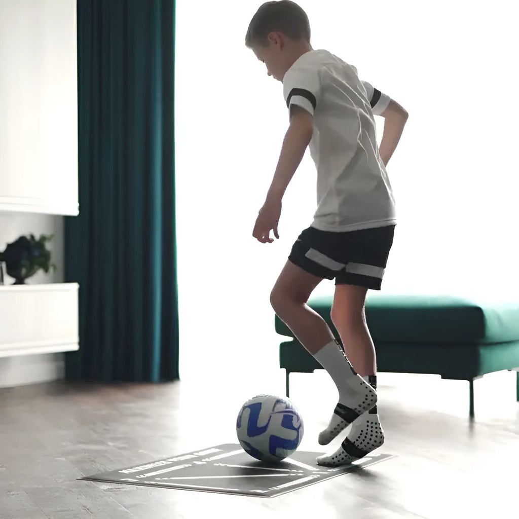 Black football training mat measuring 60x90cm with non-slip surface