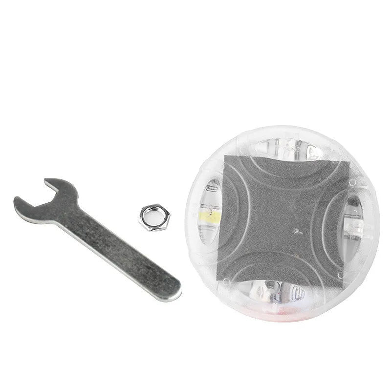 Colourful solar-powered LED hub decorative light flash for a car wheel with control switch.