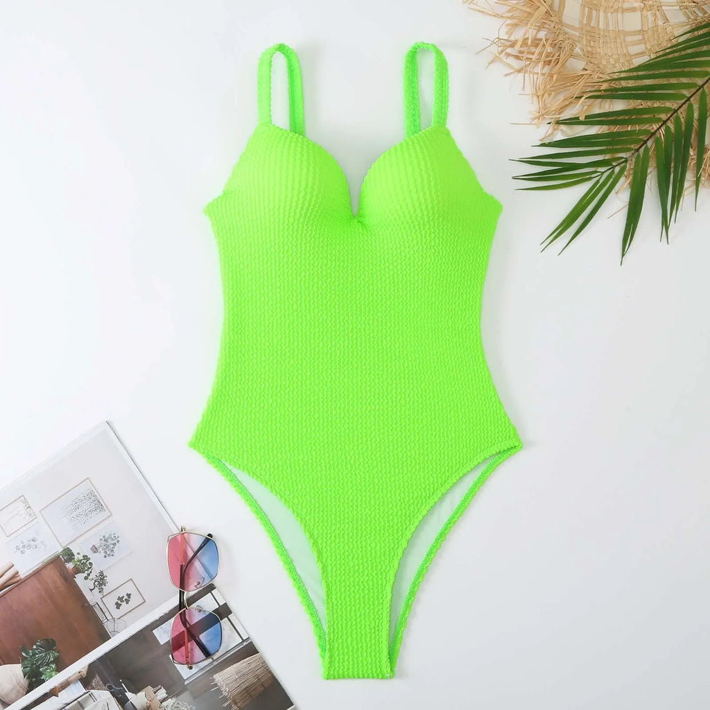 Women's black sleeveless one-piece swimsuit with sunkissed stripe detail on mannequin.