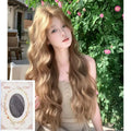 A brown curly synthetic wig with a linen hue and medium length on a wig stand.
