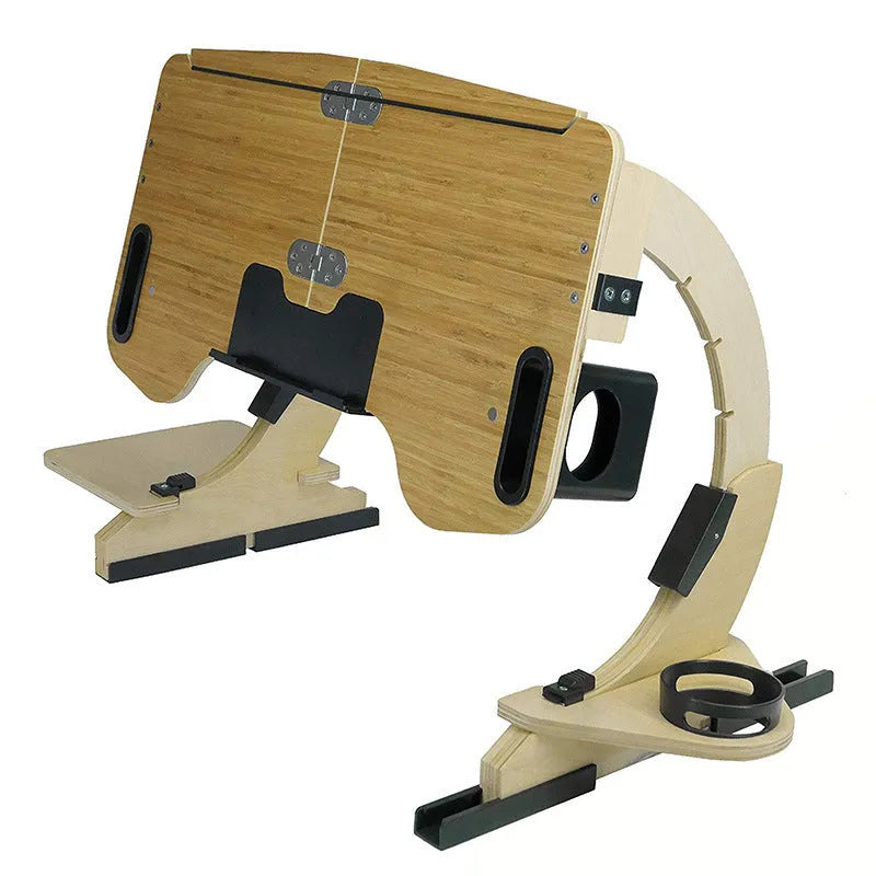 White wooden folding computer desk with adjustable angle, shown on a bed.