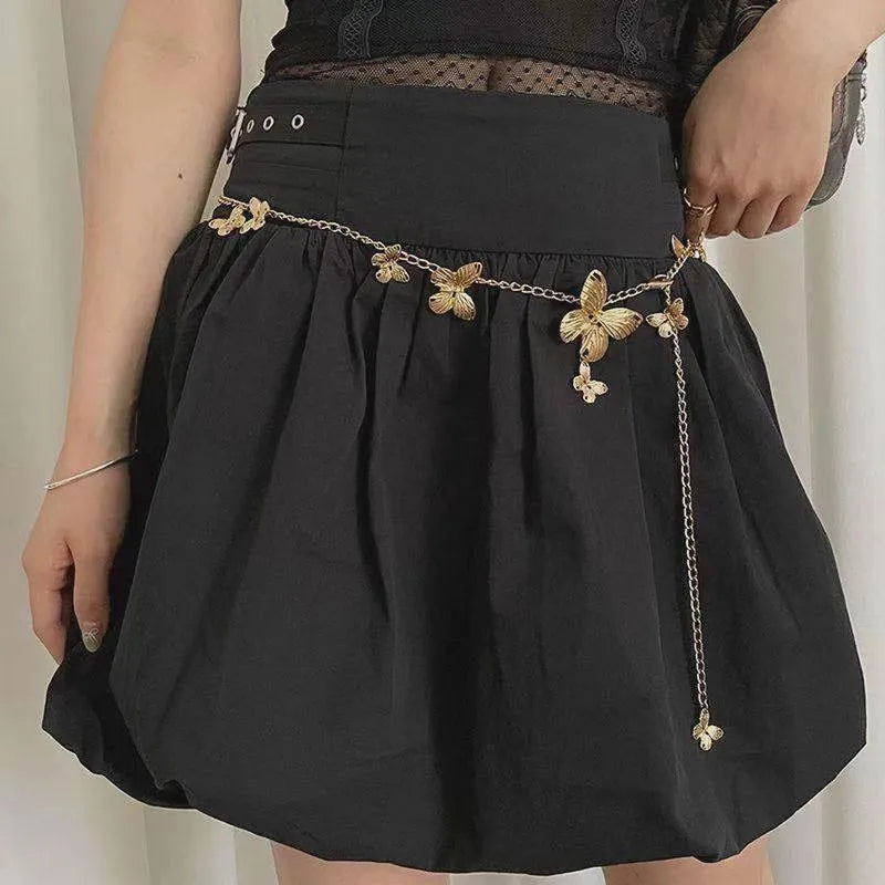 Gold and silver alloy waist chain with butterfly design measuring 104cm length