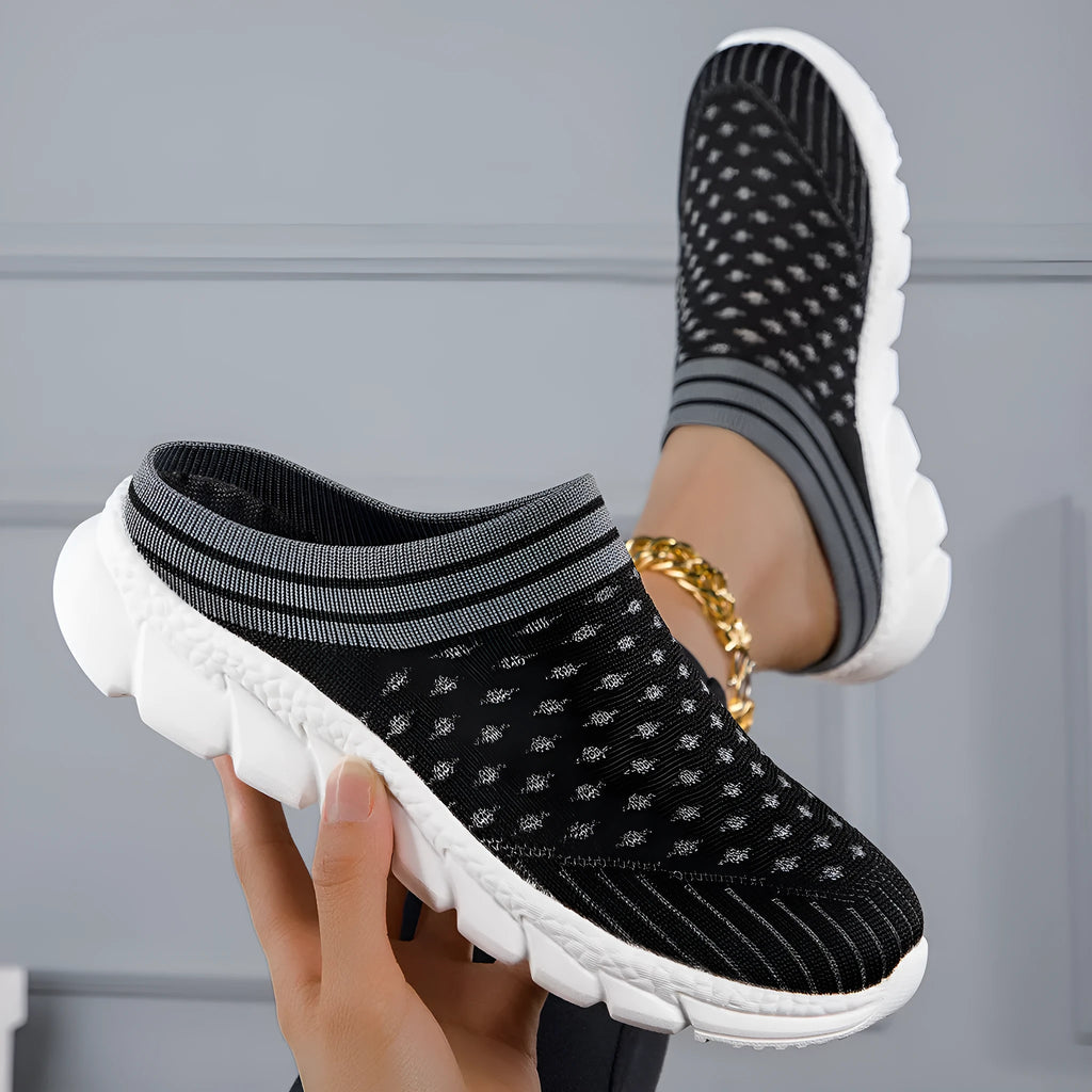 Women's black striped Flyknit slipper shoes with a height-increasing sole on a plain background