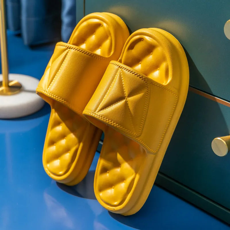 Pair of soft EVA bathroom slippers with a thick non-slip sole, shown in a selection of colours.