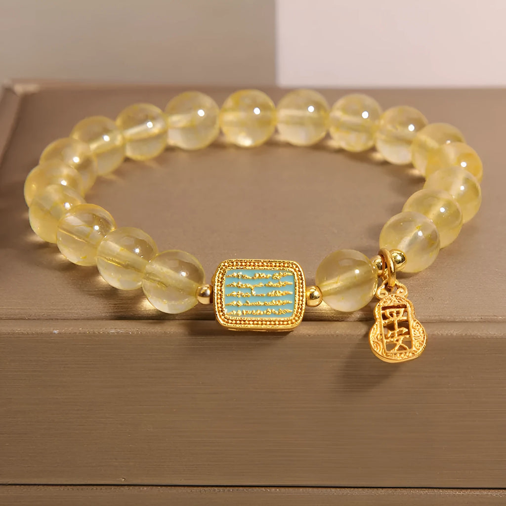 Women's yellow citrine crystal bracelet with rhinestone detailing and adjustable closure