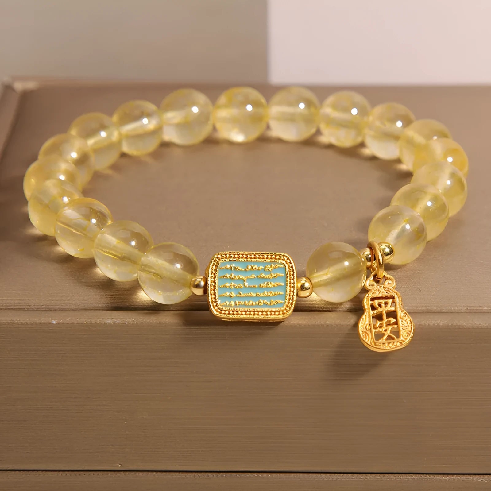 Women's yellow citrine crystal bracelet with rhinestone detailing and adjustable closure